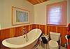 Slipper tub in the master bedroom, with a hand held shower.