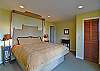 This guest room on the lower level features a king-size bed.