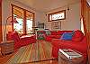 The living room is bright and cheerful.