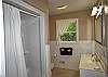 Full bathroom upstairs with walk in shower