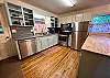 Kitchen with stainless steel appliances, including a dishwasher. 