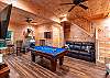 Downstairs game room with pool table and sitting areas