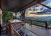 Lower deck with view of mountains and, seating area, covered hot tub