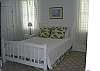Second upstairs bedroom with a queen bed.