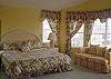 The master bedroom features a private tub and shower.