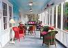 The screened porch is spacious and very comfortable for outdoor dinging or lounging.