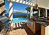 A convenient poolside wet bar with counter height seating, a (FireMagic) stainless steel gas grill and a nearby half-bathroom and pool deck shower adds to the external convienences of the villa.Tuscan colums add to the exterior ambiance of Andara.