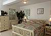 Two exterior entries near the pool area lead to Paulette's two lower suites which both contain a queen bed.