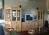 The family room has a TV, home theater with surround sound and outdoor speakers, CD, DVD and Sony Play Station.