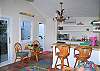 High ceilings, beautiful bright colors and ample seating complete this guest cottage down to the last detail.