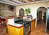 The custom built cabinetry provides ample storage and the stainless steel appliances will help the preparation of your meals go very smoothly.