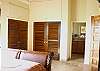 All bedrooms are, of course, air-conditioned too and there is plenty of closet space. Each bedroom has a bathroom en-suite with a tiled walk-in shower.