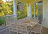 The outdoor dining set on this level is designed for 8 guests and has both garden and panoramic water views.