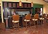 With bar seats for four, everyone can join in on the kitchen festivities. Additional kitchen amenities include: microwave, dishwasher, waffle iron, food processor, Kitchen Aid full-size mixer and ice maker.