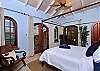 Right off of the kitchen/Great Room area is the master bedroom.  This air-conditioned king bedroom/bath suite features an alfresco shower, balcony with commanding views, LCD TV, and plenty of cool island breezes.