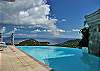 The large 30 diameter infinity edge pool has a stationary swim jet for fun and exercise. An 8-foot high waterfall adds visual excitement.  Pool lights and a wet bar are final touches.