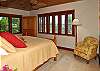 All three spacious bedrooms have split air conditioners, Tommy Bahama furnishings, a TV in a corner armoire and coral floors and ledges.