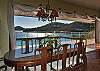 The interior dining table can comfortably seat up to eight guests. It faces Rendezvous Bay where you can see shimmers of light dance over the water.