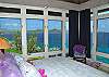 Remarkable views carry on throughout the villa, as here in the north bedroom.
