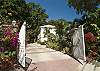 As you walk through the electronic gates of Villa Paulette, you begin to see what separates this villa from the others...

set within a gated yard-with tropical landscaping that surrounds and beckons you to enjoy the ambiance of the islands...