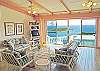 Immediately beyond lies the centrally-located living area with pickled wooden floors. There is a TV, VCR/DVD, stereo and even a writing desk.