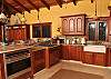 Cooks will love the unobtrusive pop-up vent for the stove and the extra large oven. Strategically placed pendant lighting adds focal lighting where you want it.