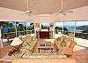 The enormous Great Room, decorated in cool pastels, has soaring cathedral ceilings and wall-to-wall sliding glass doors that open onto expansive wrap-around decks and endless views of the Caribbean Sea. For your pleasure, there is an entertainment center with Satellite Tivo-style TV, VCR, and DVD.