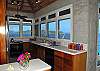 With a large kitchen island and wrap-around views, the finest chefs will be at home here.