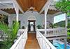 The fine gingerbread trim and architectual details, lush landscaping and glimpses of a ready swimming pool delight your senses.