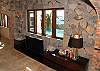 A 46 inch flat screen TV with satelite service, a DVD, and a Wii are ready for your entertainment. The stone walls  are personally handcrafted by Joseph, a well known stone artisan on St. John. His design incorporates native stones and shells, including conch and scallops.