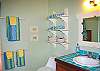 A colorful ensuite bathroom completes the picture.