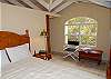The area is open to the ceiling for improved air flow. An arched windrow frames the quiet hillside.