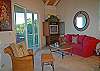 Each great room has cathedral ceilings, comfortable seating, a complete entertainment center, and sliding glass doors on two sides opening to glorious views.