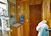 The bathroom boasts a completely tiled glass block enclosed shower and is accessible directly from the great room.