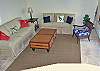 An indoor staircase takes you down to the lower level of Andara which houses the den with a private balcony, LCD TV and a convertible queen size sofa. This room opens out to...