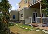 Stepping-stones take you through this flat, grassy yard to the pool/deck/gazebo area for more relaxation!