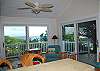 The guest cottage provides ample privacy and fantastic ocean views. This third  bedroom has a large living space, dining area and kitchenette. This room is especially great for guests wanting a late night snack or who have children wanting an early breakfast.