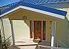 The outside entrance is just a prelude to what lies within this spectacular villa. An inside stairway links the upper level to the lower level.