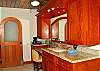 The spacious ensuite bathroom is almost a mirror image of the one upstairs.