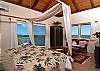 In the master bedroom, look out onto the ocean while resting in bed and lounge on your own private deck.