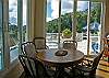 The poker table converts to a beautiful dining table. Slide open a window to hand a cool drink down to the lap-swimmer floating by.