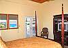Enjoy the retreat of this quiet bedroom away from the rest of your group. This queen sized four-poster bed faces the ocean view.......
