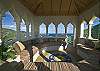Set with a gorgeous Moroccan mosaic floor, the open, pointed arches offer spectacular views of Chocolate Hole, Great Cruz Bay, the pool courtyard and St. Thomas in the distance.