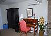 A beautiful wood writing desk tucked near a quiet corner is perfect for your laptop, or writing some postcards to friends and family.