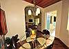Set apart from the living room area is this elegant dining area set for two or four guest provides wonderful island views.