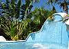 There are many pleasures to experience - play beneath the waterfall in the free-form pool, stroll the carefully crafted gardens, or lounge while you take in the panoramic ridge top views.