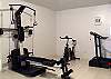 The fully air conditioned exercise area is equipped with a Weider Platinum XP800 Bowflex Machine, a Weslo Cadence 7 Treadmill, and a Spin Bike.