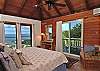 On the upper level with the main house, the spacious West bedroom has a private balcony too.