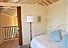 The east sleeping area on the upper level  has a trundle bed, but no air conditioner. It's entranceway is draped for privacy just like the west room.