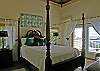 Each bedroom has individual safes, closets, air conditioning controls, ceiling fans and full baths ensuite for privacy. This bedroom features a queen sized 4-poster bed.